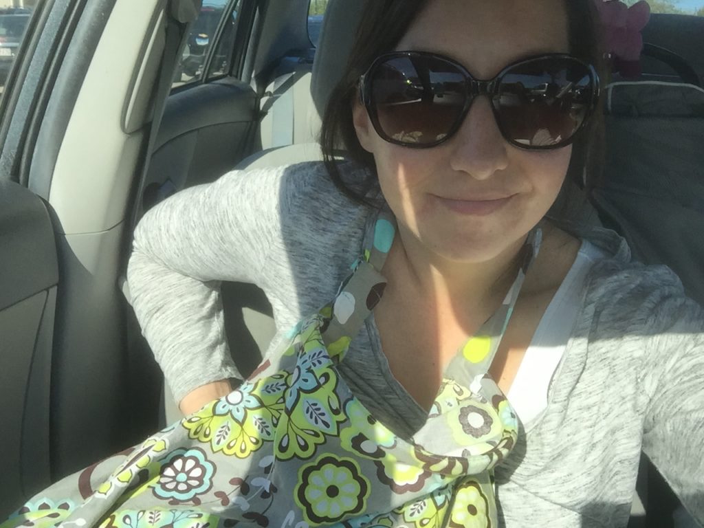 A mom pumping breast milk in the car