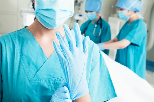 Healthcare professionals wearing gloves and masks