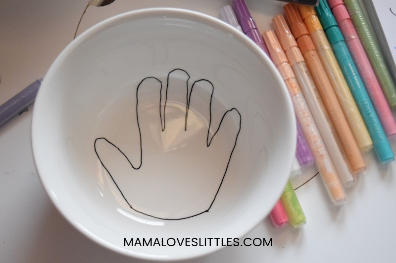 bowl with handprint drawn at bottom