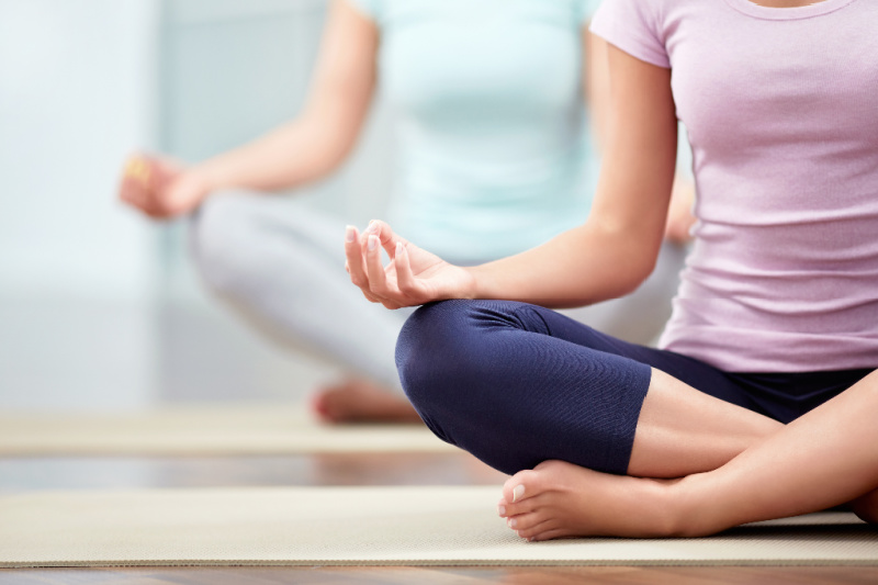 Women doing meditative yoga, pregnatal yoga can potentially lower your risk for developing gestational diabetes