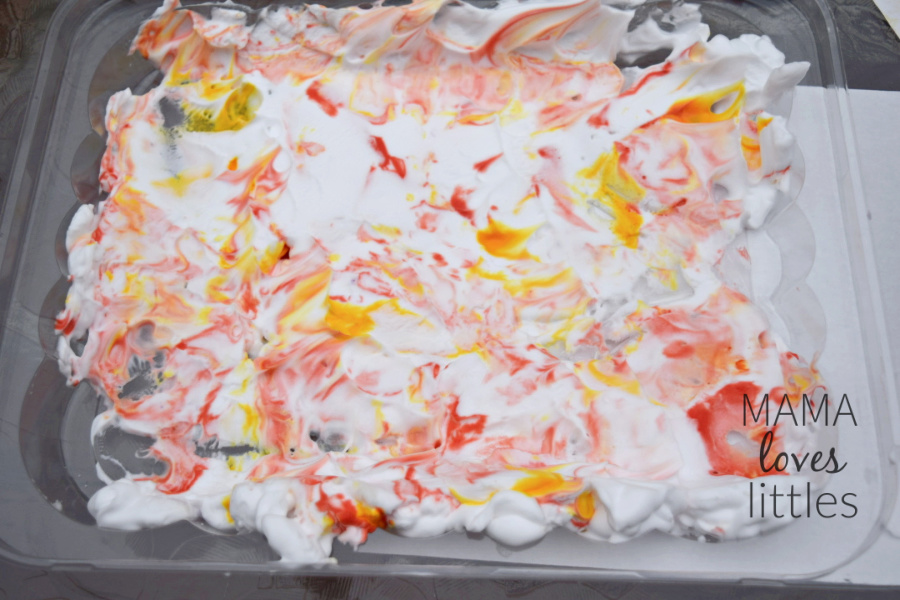 Shaving cream with red and yellow food coloring mixed into it