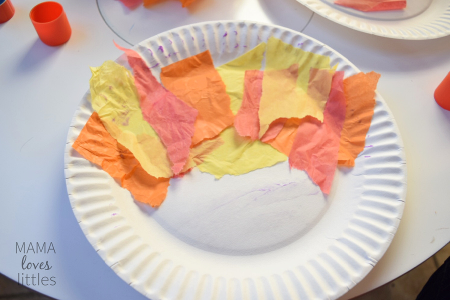 paper plate with tissue paper in patter to resemble turkey feathers